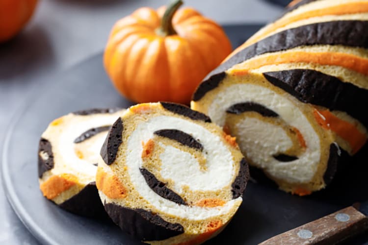 pumpkin cake roll with mascarpone whipped cream is a striking centerpiece