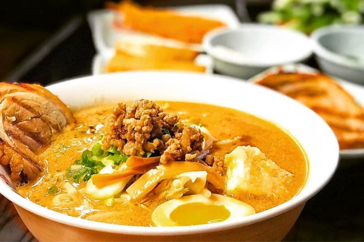 This ramen in Edmonton comes packed with noodles and pork broth as well as vegetables and miso minced pork