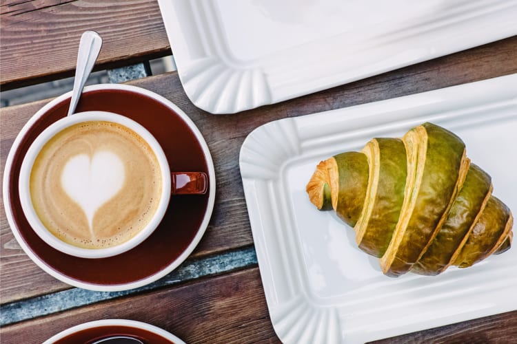 Cappuccino paired with pistachio croissant