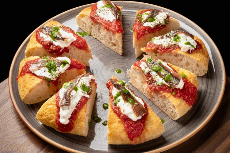 Thick pizza made with soft dough and stone-ground wheat, topped with anchovies