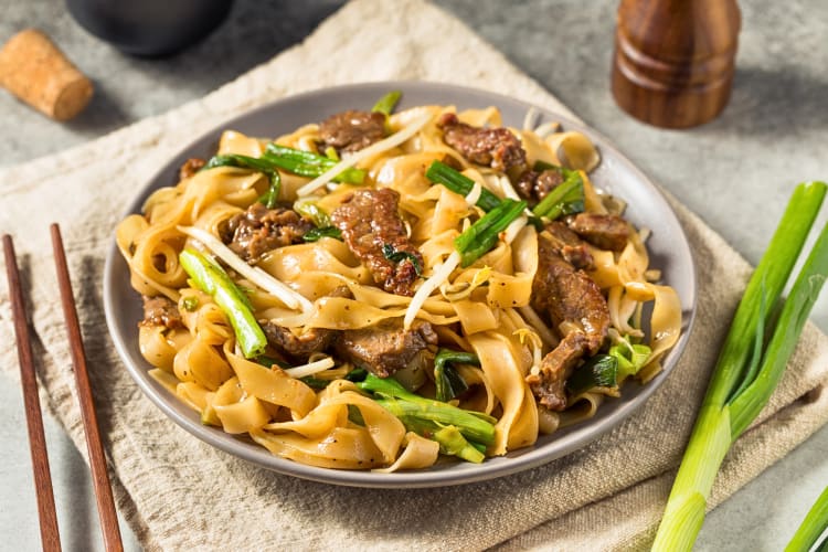 Beef chow fun with noodles and scallions