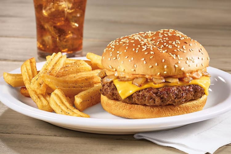 A burger and chips from Denny's, a popular restaurant where kids eat free
