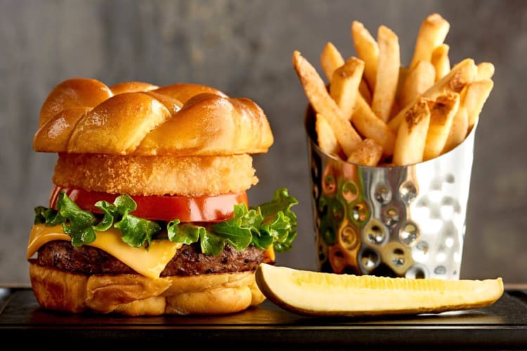 A burger and fries from Rainforest Café, a restaurant where kids eat free