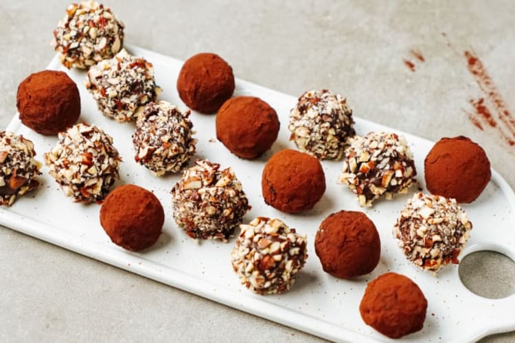 A board of homemade chocolate truffles.