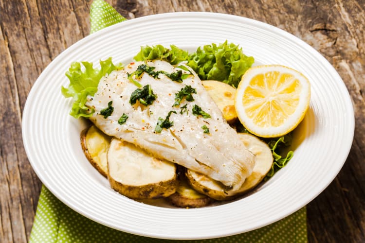 Sablefish Fillet served with potatoes and lime