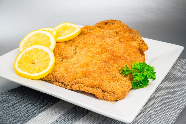 Wiener schnitzel served with lime and parsley