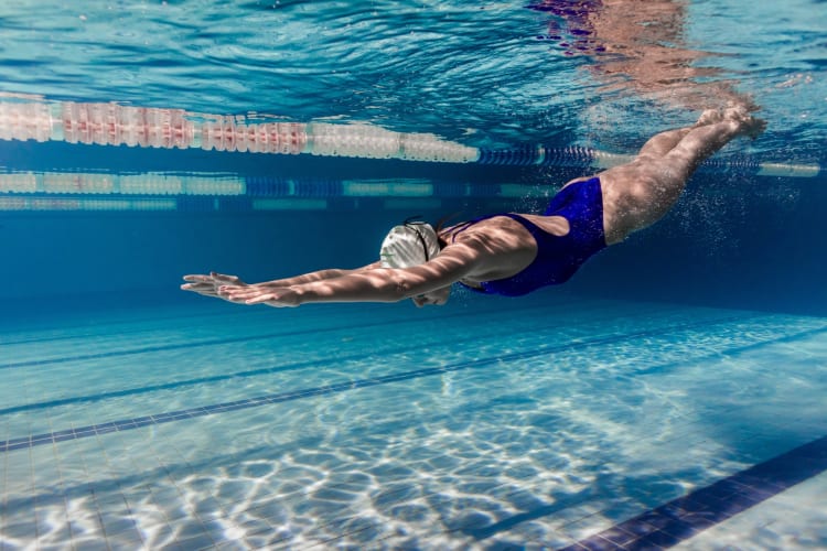 Woman diving in a swimming pool