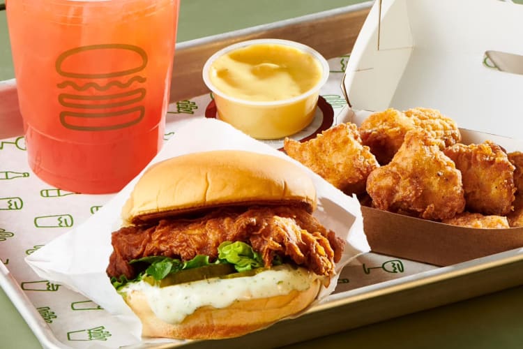 A drink, a burger, sauce and nuggets from Shake Shack