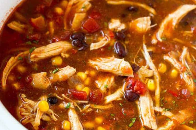 slow cooker chicken enchilada soup is spicy, smokey and packed with protein