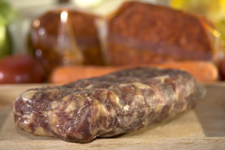 Soppressata in a wooden cutting board