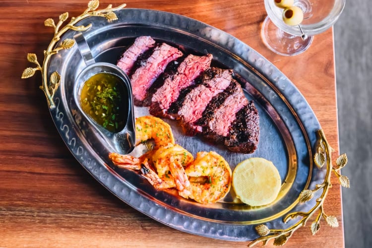 Try the surf n’ turf with prawns at this steak restaurant in Denver