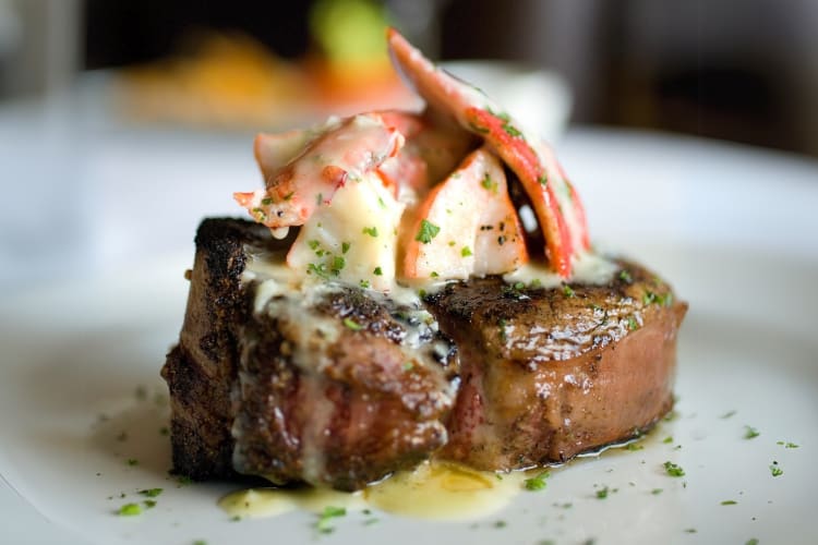 Filet mignon topped with lobster scampi