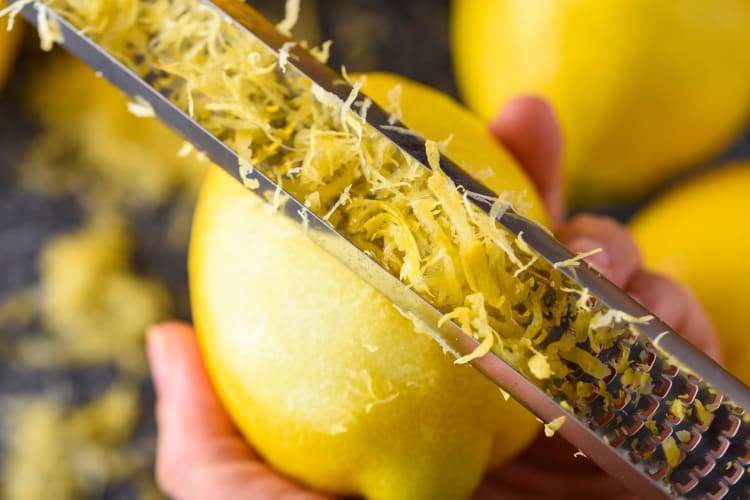 Man grating lemon zest