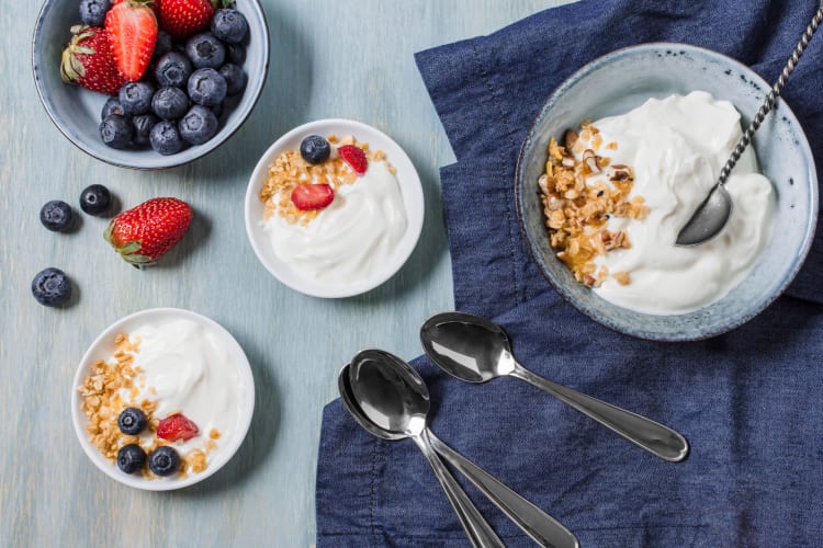 tasty breakfast with Greek yogurt and fruits freepik