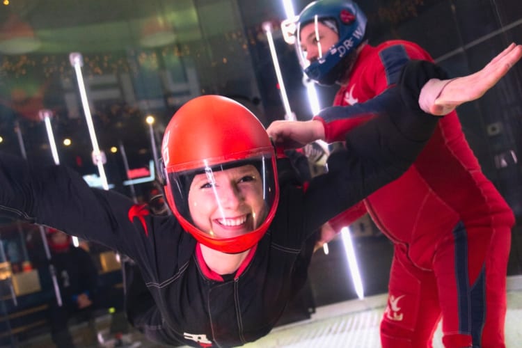 Woman practicing indoor skydiving