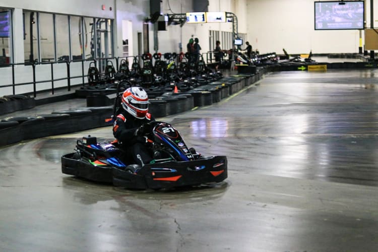 A man racing at Victory Lane Karting, a fun place for team building activities in Charlotte