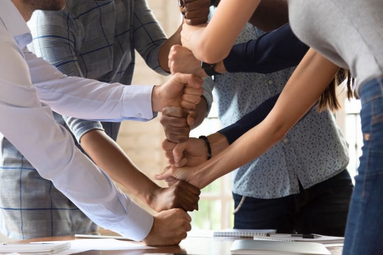 Diverse employees engaged in team building activity 