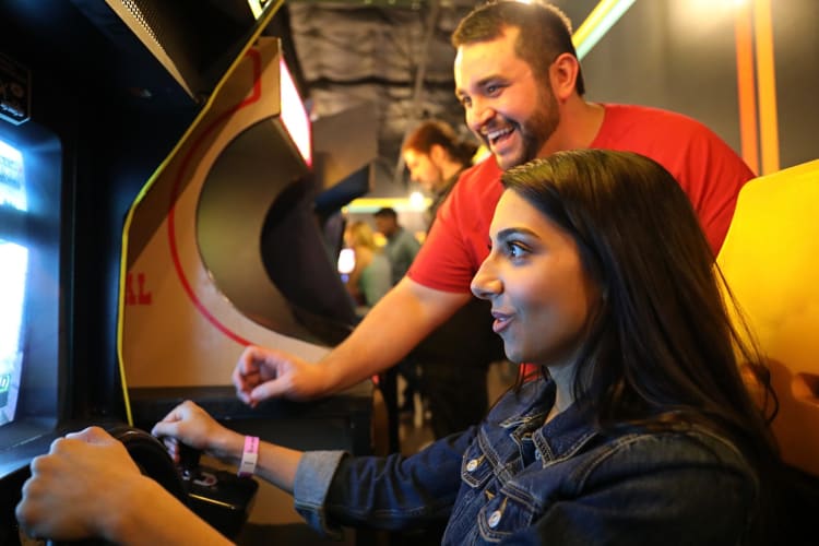 Two people playing a game at Free Play, a great spot for team building activities in Dallas