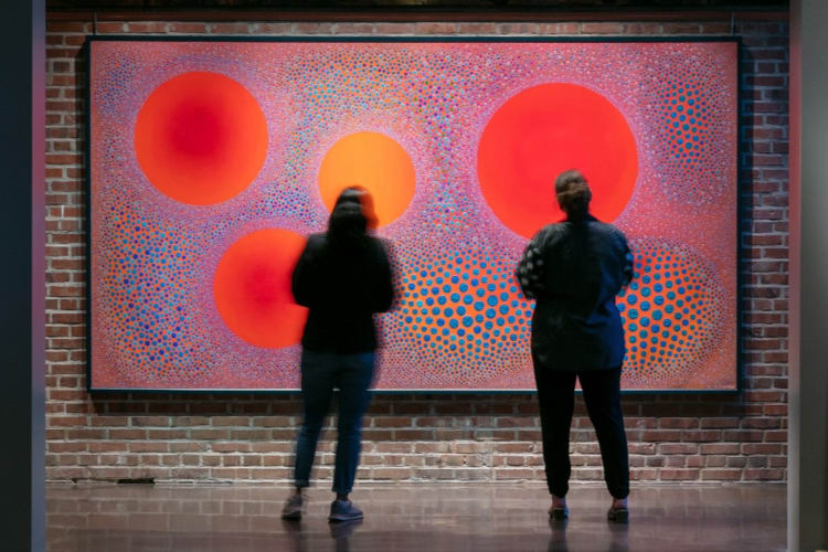 two people at an exhibit in the Denver Art Museum