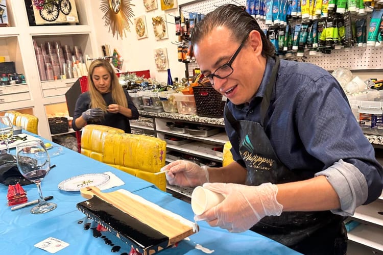 Two people creating pieces of art at J. Philippus Art Studio & Gallery