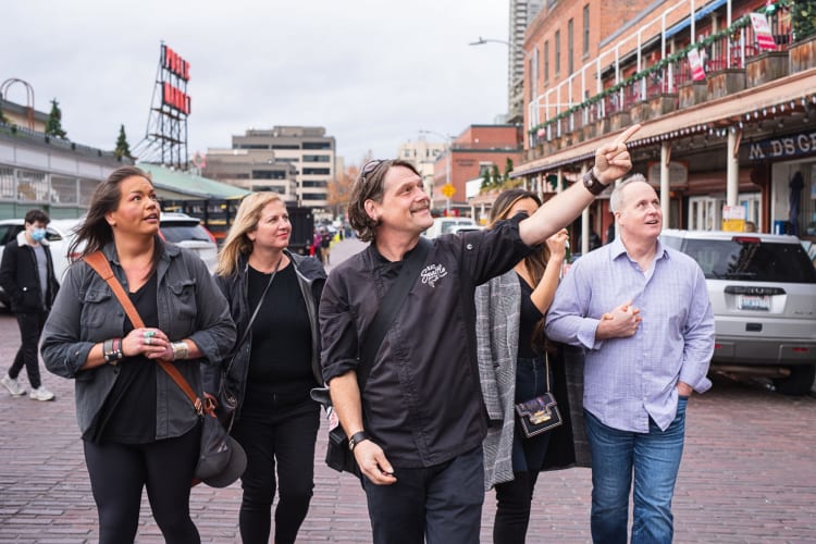 Four people on a food tour with a professional guide