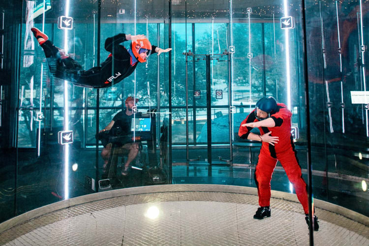 Someone learning indoor skydiving, which is a thrilling team building activity in San Diego