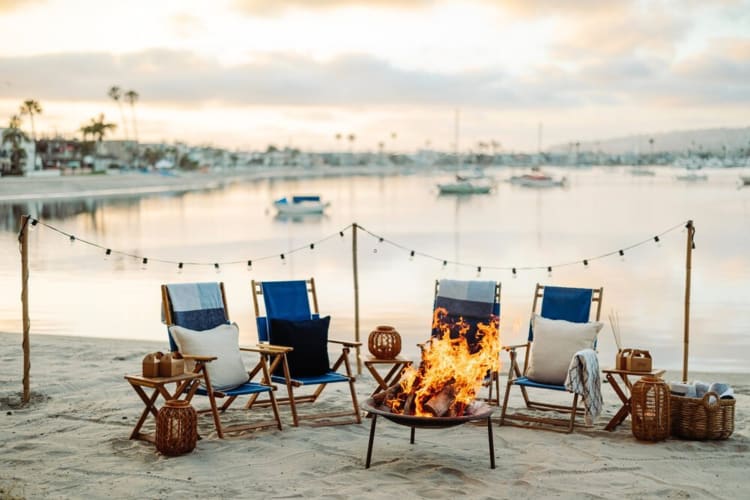 A bonfire surrounded by chairs — the ideal setting for a team building activity in San Diego