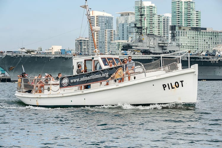 People on a sailboat out at sea, which is a thrilling team building activity in San Diego