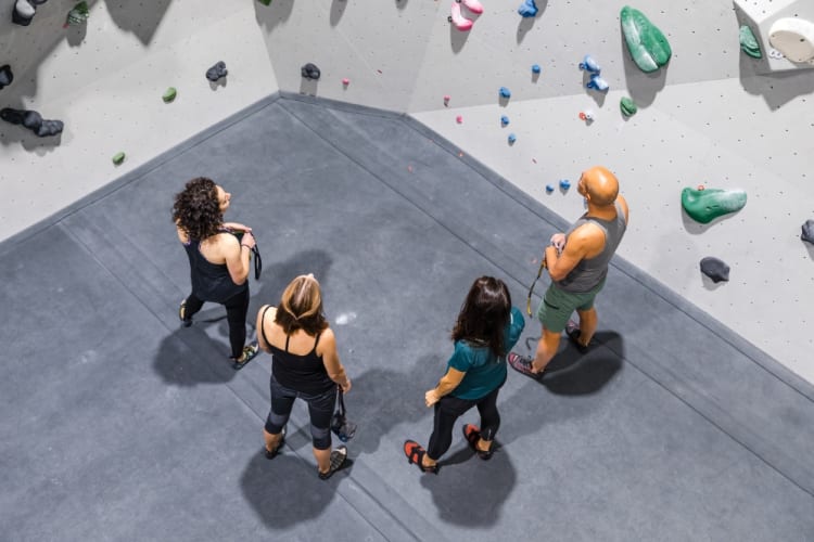 A group prepares for indoor climbing