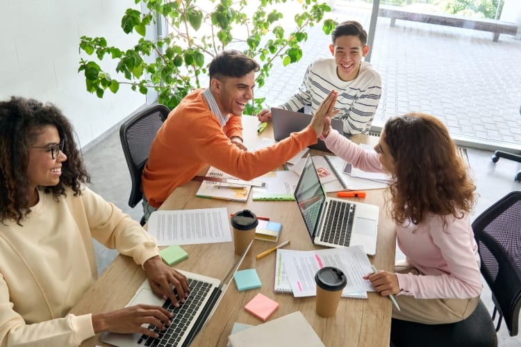 A cheerful team collaborate in the office