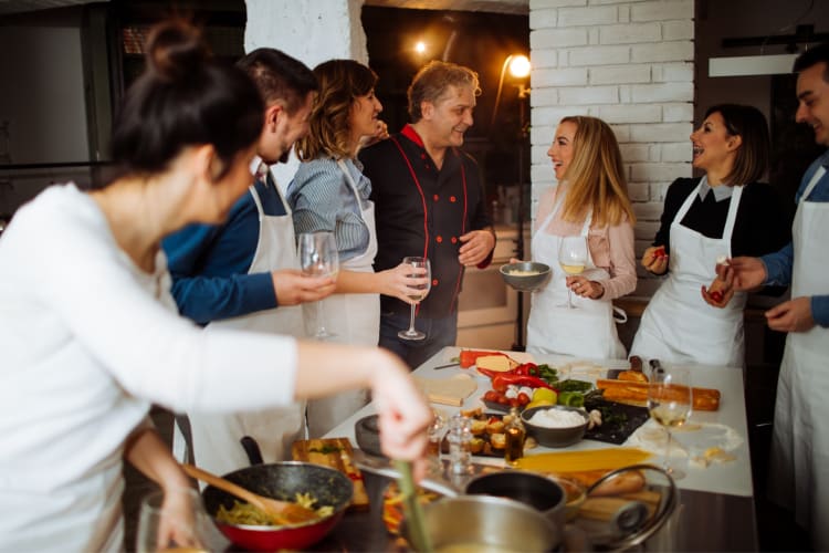 a group of co-workers taking a cooking class together