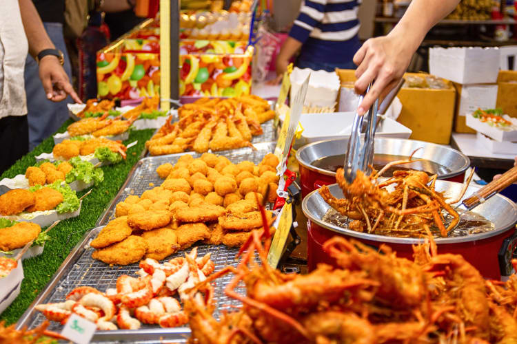 An assortment of Thai street food on display at a market