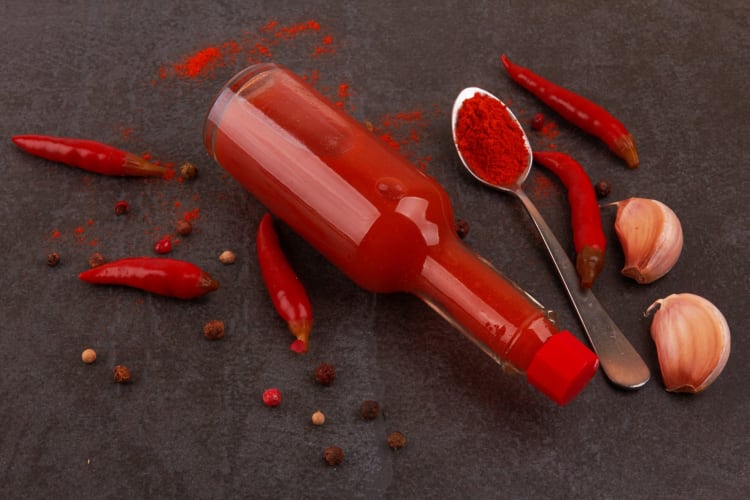 Spicy peppers actually make a delicious counterpart to a lot of fruits and other spices, leading to a whole new category of types of hot sauce.