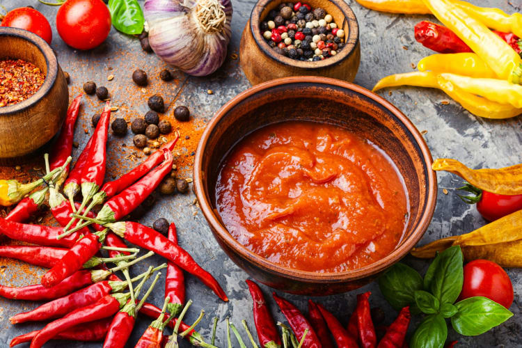 Known for bright, bold and tropical flavors Caribbean types of hot sauce often feature a sweet and spicy combination of fruit and hot peppers.