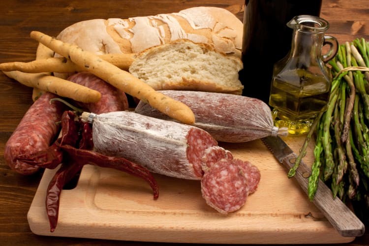 Cacciatore salami and bread on a wooden board