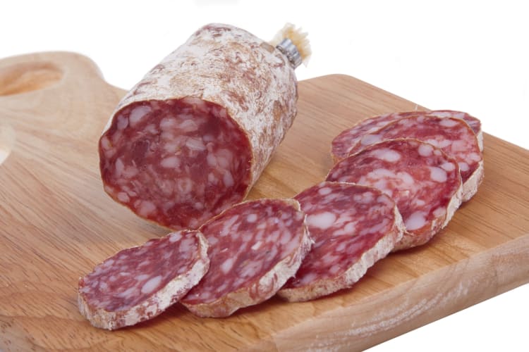 Felino salami sliced on a board