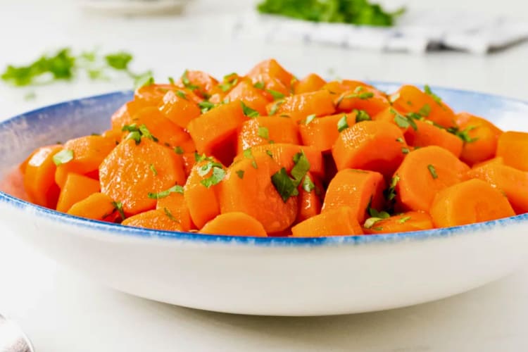 Candied carrots in a bowl.