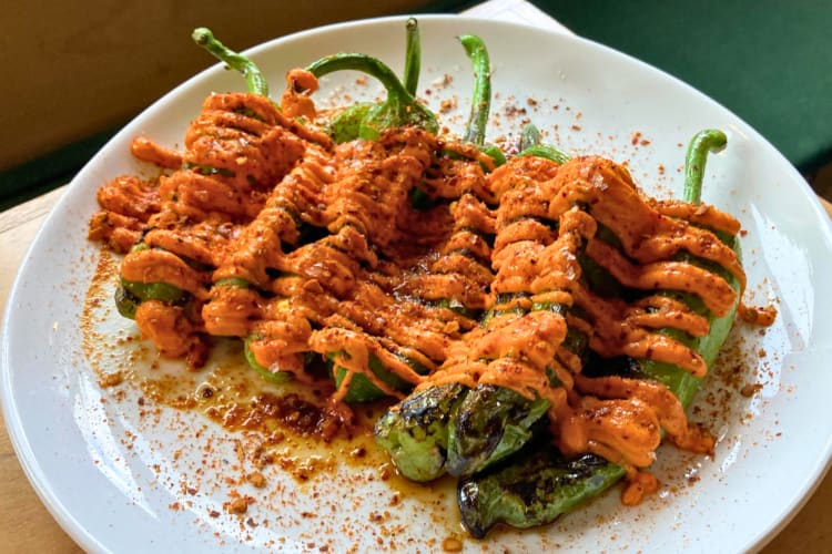 Grilled peppers topped with tomato sauce