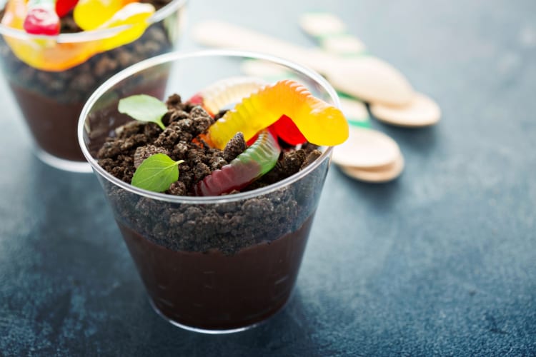 Chocolate dessert topped with cookies and gummy worms