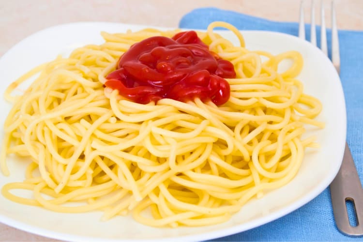 Spaghetti topped with ketchup