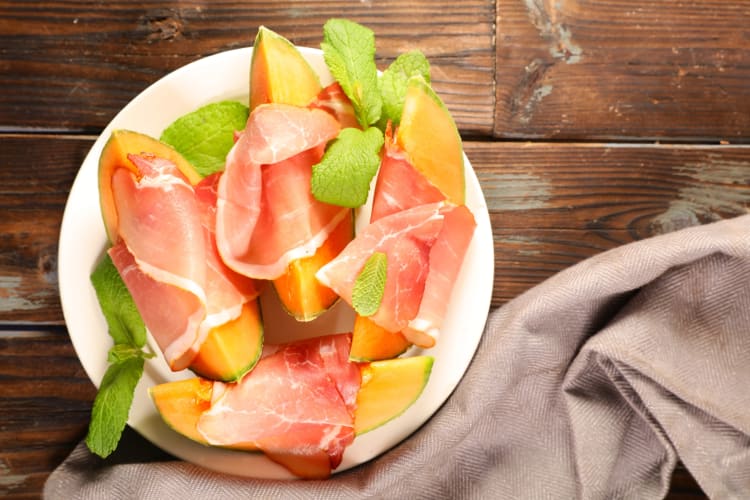 Cantaloupe wrapped in Serrano ham