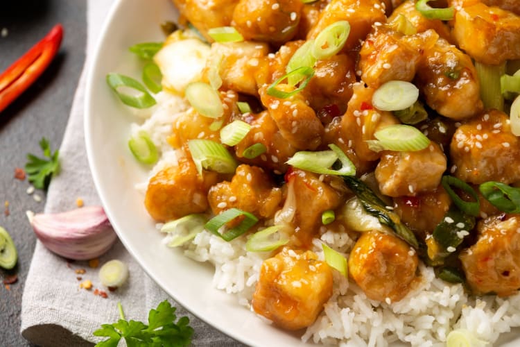 General Tso Tofu with rice, green onion and pak choi