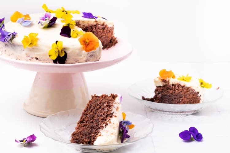 Gluten-free chocolate cake with edible flowers