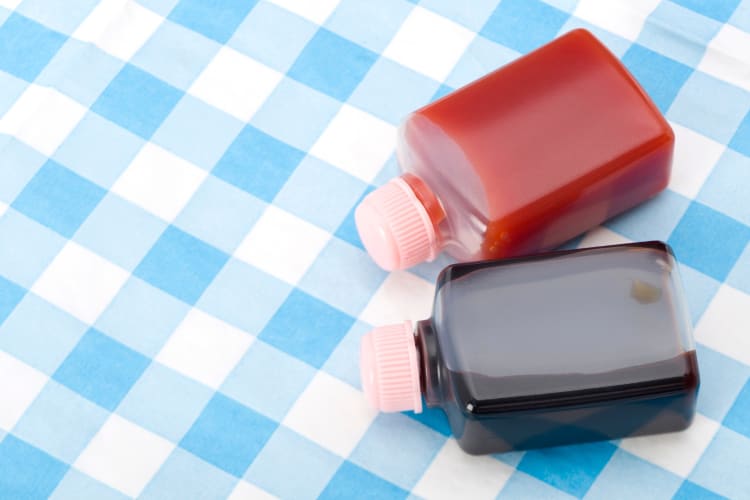 Bottles of soy sauce and ketchup