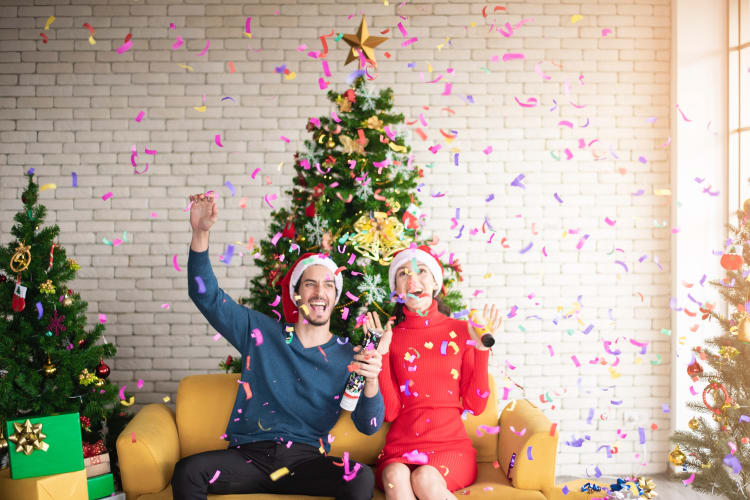 man and woman enjoying a work christmas party that is actually fun