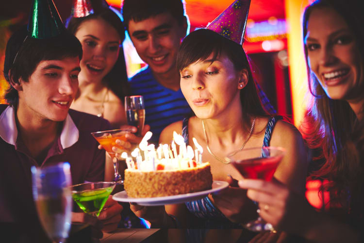 People celebrating a birthday dinner in Pittsburgh