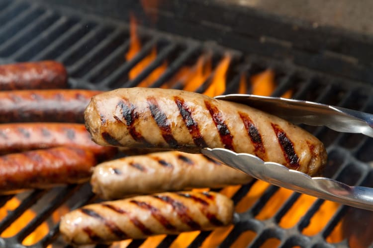 bratwurst will grill marks over a grill