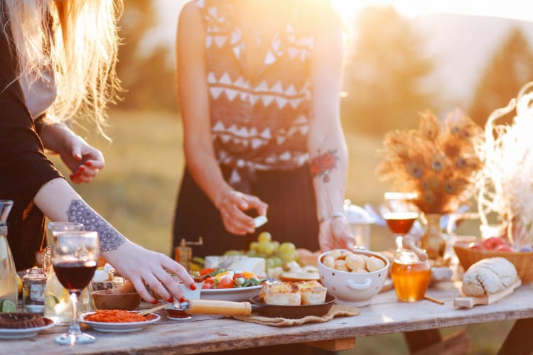 Close Up Of Picnic Party In The Park Drink Table With Large