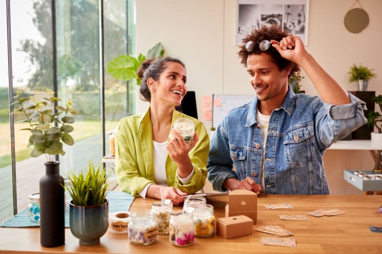 A couple having a good time on a candling-making date