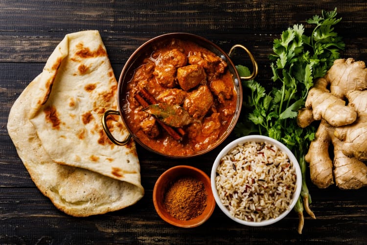 chicken tikka masala paired with fluffy naan and fragrant rice